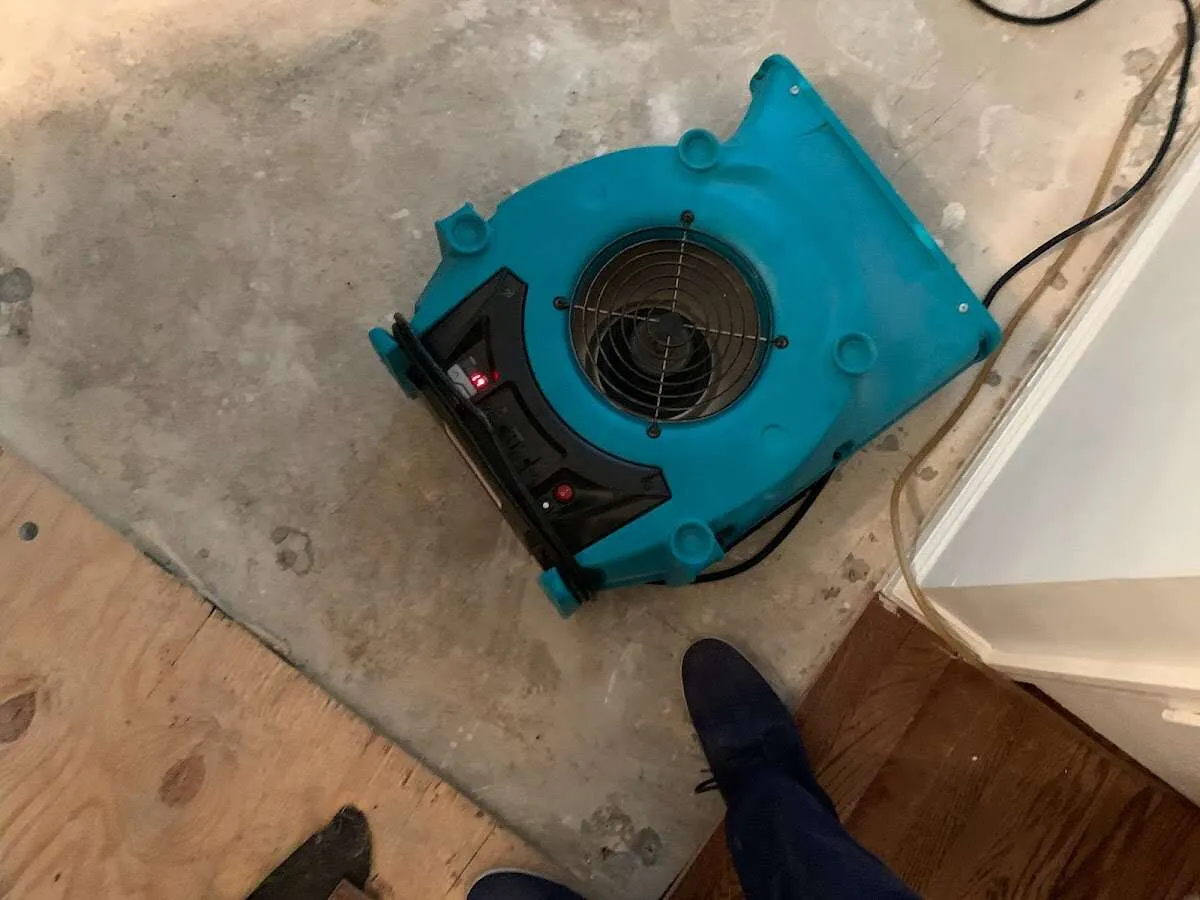 Air mover drying subfloor during Leak Detection & Repair in Anadarko